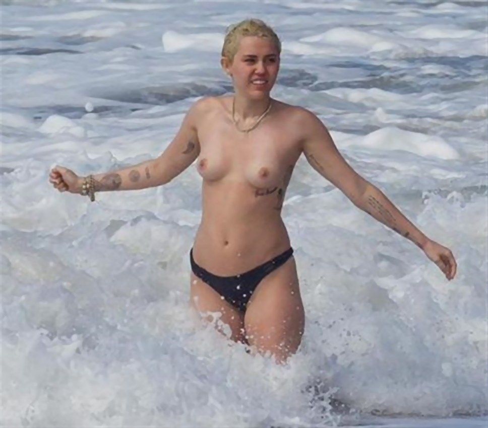 Miley Cyrus Tattoo Topless  at the Beach Hawaii